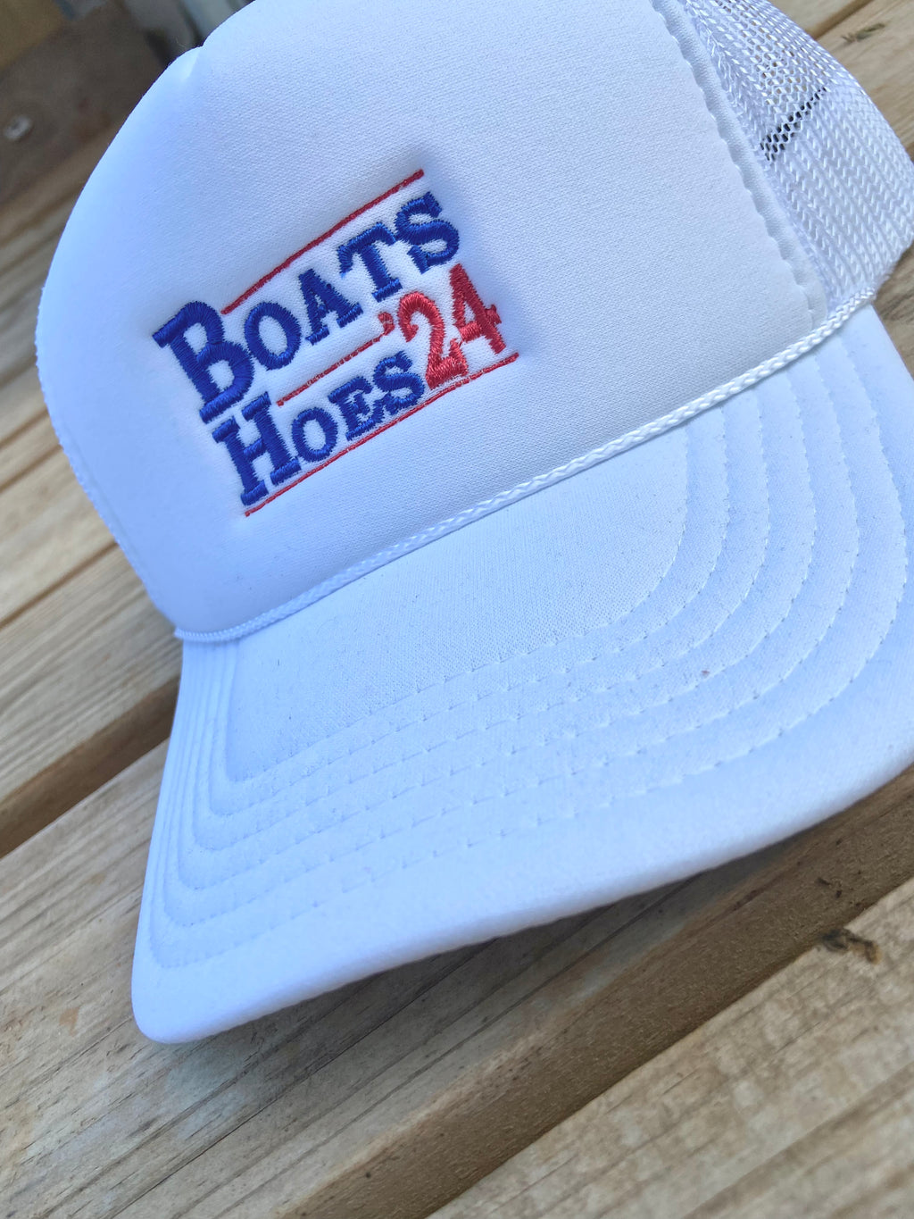 Boats hoes ‘24 white embroidered trucker hat